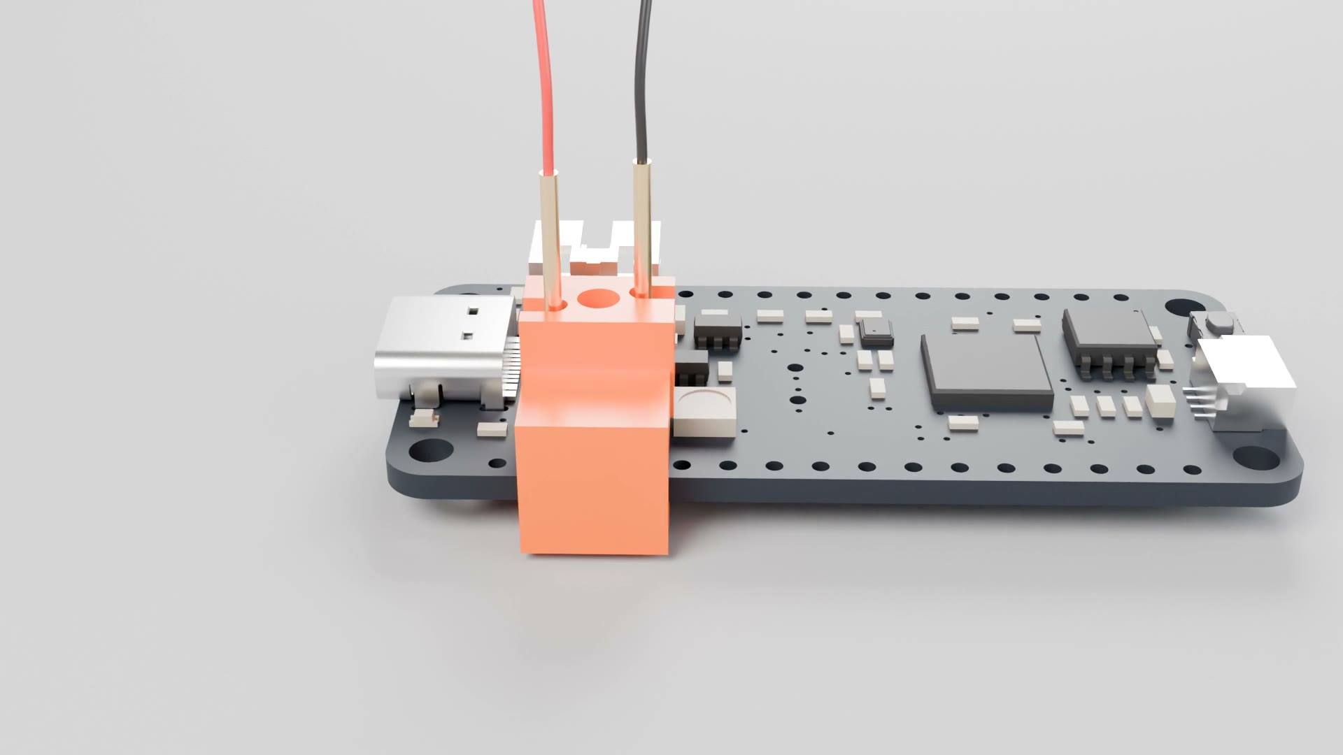 Orange edge clamp on a Feather RP2040 RESET button